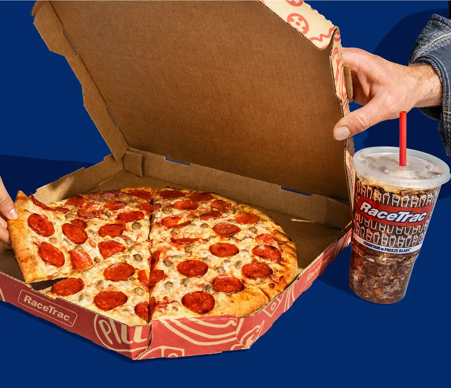 RaceTrac pepperoni and sausage whole pizza with a fountain drink