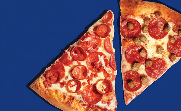 Two slices of triple pepperoni pizza