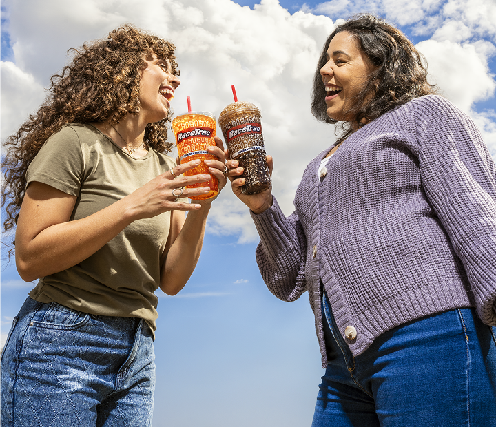 Women enjoying a fountain and frozen drinks from RaceTrac